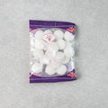 Close-up image of round naphthalene mothball tablets for wardrobe freshness