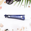 Close-up of durable plastic banana hair clip with ergonomic grip