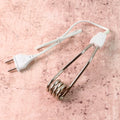 Portable immersion heater rod showing its compact design for travel
