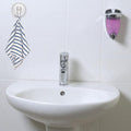 Clear plastic suction cup hook holding decorative hanging items