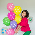 Multicolor balloons creating a cheerful atmosphere for a Holi celebration.