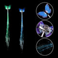 Close-up of vibrant LED butterfly hair braid clip design