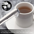 Stainless steel ice cube tongs in a kitchen setting, ready for use.