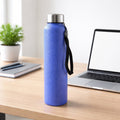 Close-up of leakproof screw cap on blue stainless steel water bottle
