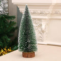 Miniature Christmas tree with snow-covered branches ideal for festive office decoration