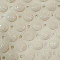 Flexible anti-slip bath mat folded to show versatility and easy storage