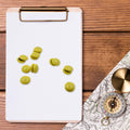 Strong plastic magnetic pins securely holding documents on a magnetic board.