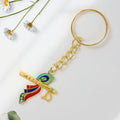 Back view of metal Krishna flute keychain highlighting craftsmanship