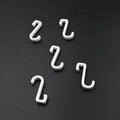 Multi-angle view of the strong self-adhesive plastic hook, highlighting its sleek design.