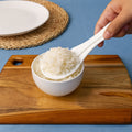 Wide flat non-stick spoon designed for serving sticky rice