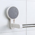 Self-adhesive towel rod mounted on a white clean wall