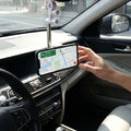 Phone stand positioning a mobile phone inside vehicle for easy viewing