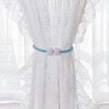 Set of two magnetic curtain tiebacks featuring pearl accents