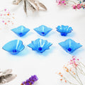 The elegant plastic candle holders from the Diwali Diya Set displayed on a surface.
