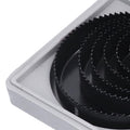 Multiple carbon steel hole saws of different diameters, highlighting the range available in the kit.