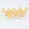 Golden net covered LED flameless candles emitting warm white light for home decor