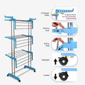 A close-up of clothes drying on the multi-tier laundry rack, highlighting its capacity.