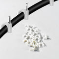 Strong hold plastic cable clip attached firmly to wooden surface