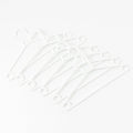 Stack of 6 white plastic clothes hangers ready for use