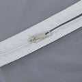 Closeup of durable full-length zipper on the breathable fabric suit cover.
