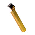 The electric trimmer shown with its cleaning brush and lubricating oil for maintenance.