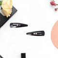 Showcasing the durable Matt Black finish of the Metal Tik Tak Hair Clips.