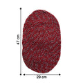 Close-up of red floor mat showing textured fabric