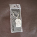Back view of the Ganesh Metal Keychain, showing its smooth edges and premium finish.