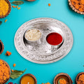 Angled view of the plastic Kumkum Thali Holder, highlighting its compact size.
