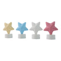 Hand holding a glowing Star LED Tealight Candle, highlighting its portable and safe design.