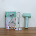 The compact Cordless Electric Whisk resting on a clean kitchen counter.