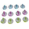 Transparent wall hooks holding small items like towels or utensils in a home setting.