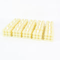 Decorative table setting illuminated by warm LED flameless cube candles