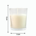 The Sweet Dreams Scented Votive Candle creating a serene ambiance on a bedside table.