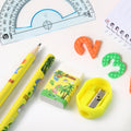 Multiple angles of dinosaur printed kids stationery set showing full kit
