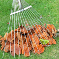 Side view of the adjustable garden rake showcasing its ergonomic long handle design.