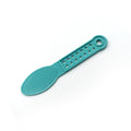 Hand holding the plastic foot scrubber, demonstrating its comfortable grip for pedicures.