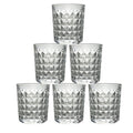 A stack of elegant diamond-cut glass tumblers, illustrating their compact storage and design.