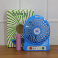 Mini table fan operating quietly on desk providing refreshing airflow