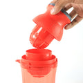 Side view of manual juicer handheld for portable use
