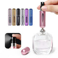 Assortment of colorful 5ml travel perfume atomizers, showcasing variety.