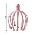 Side view of the manual scalp massager, highlighting its compact design.