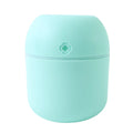 Lifestyle shot of the Mini USB Humidifier placed in a comfortable living space.