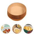 Air fryer basket kept clean with a disposable air fryer liner after cooking.