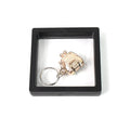 Mini nail clipper keychain in clear showcase with 3D floating effect