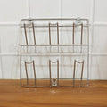 Close-up of stainless steel wall-mounted mug and cup holder rack