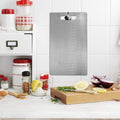 Close-up of hygienic stainless steel chopping board surface