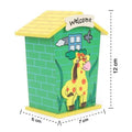 The wooden piggy bank with coins being inserted into the slot.