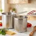 Close-up of stainless steel frying pot with strainer basket detail