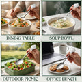 Stylish stainless steel carved handle spoon on a modern dining table setting.